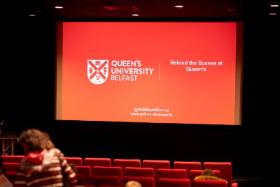 Behind the scenes at Queen's presentation slide displayed on large cinema screen in the QFT theatre screen